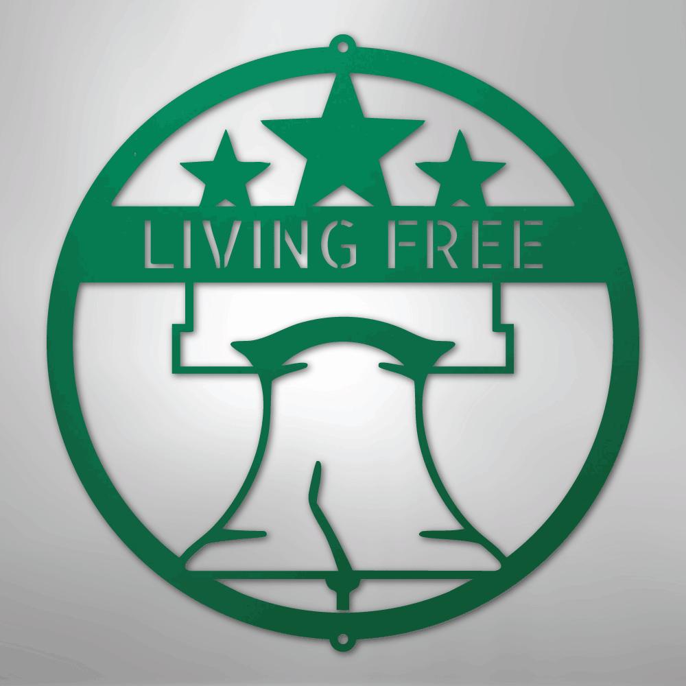 Green metal Liberty Bell monogram wall art with "LIVING FREE" text and three stars.