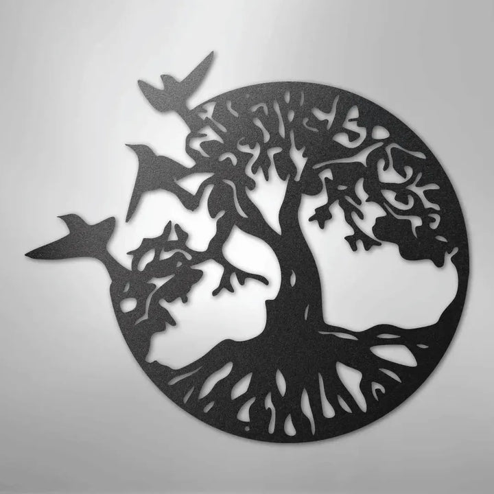 Black metal wall art depicting a tree of life with roots and branches, encircled, with three birds flying.