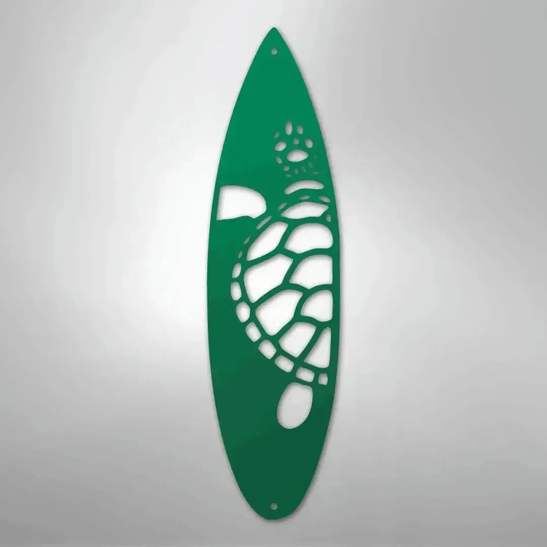 Green metal surfboard wall art with a cutout turtle design.