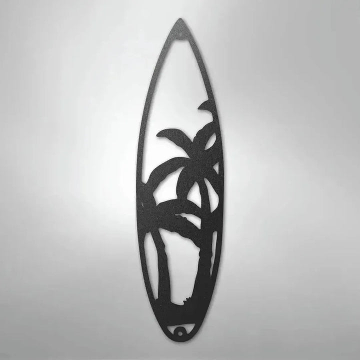 Black metal surfboard wall art with palm tree cutouts, ideal for indoor/outdoor surfer decor.