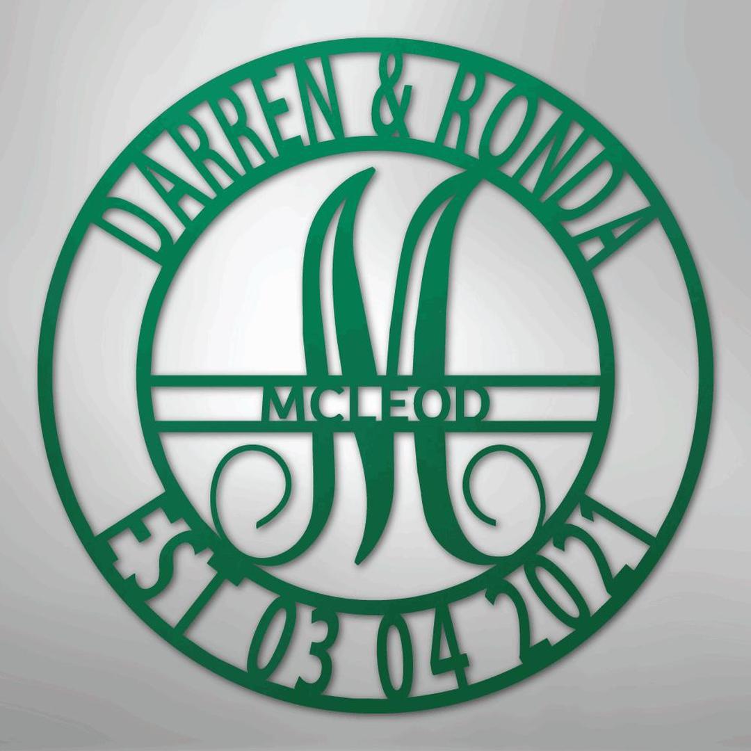 Green metal family name wall art with "Darren & Ronda," a large "M," "McLeod," and "Est 03 04 2021" in a circular design.