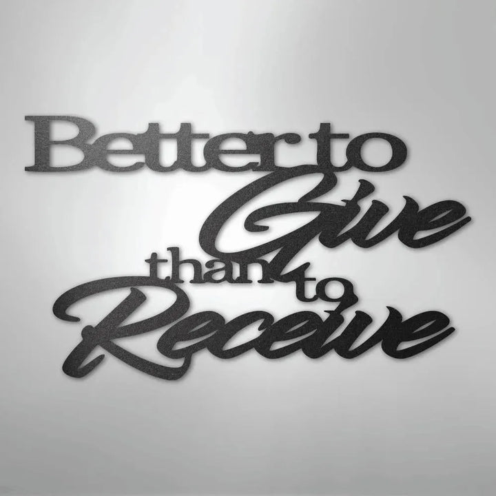 Black metal wall art with "Better to Give than to Receive" in elegant script and block fonts.