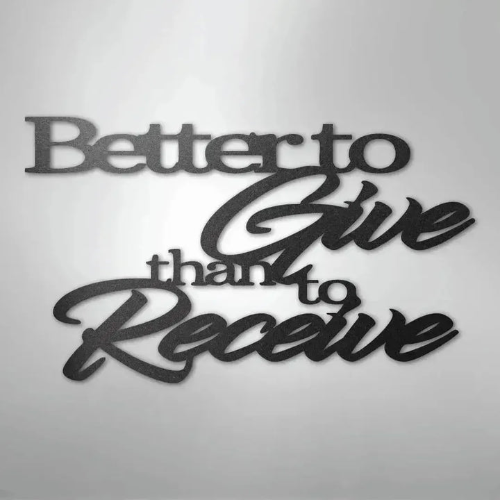 Black metal wall art with "Better to Give than to Receive" in elegant script and block fonts.