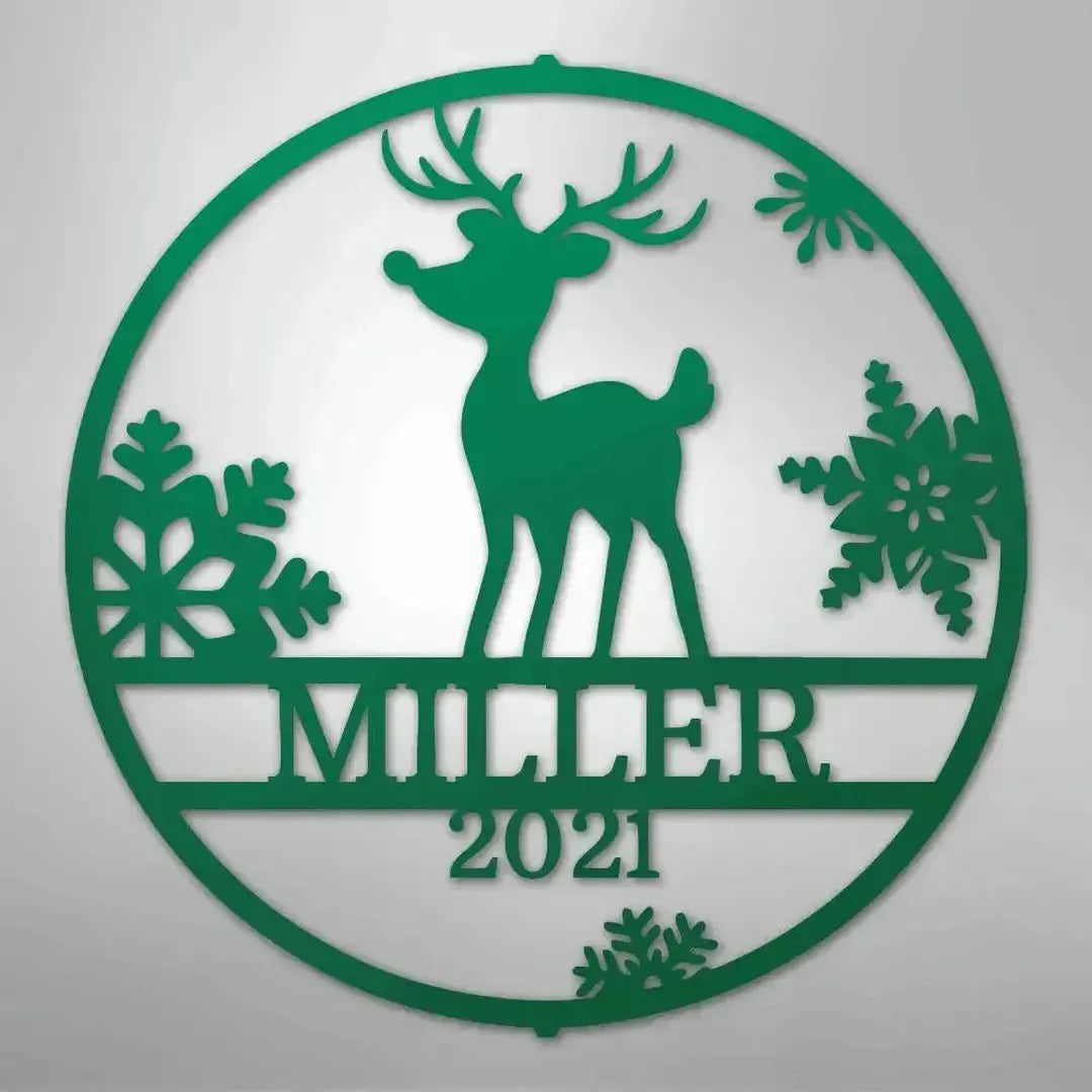 Green metal wall art featuring a reindeer, snowflakes, and "MILLER 2021" text within a circular design.