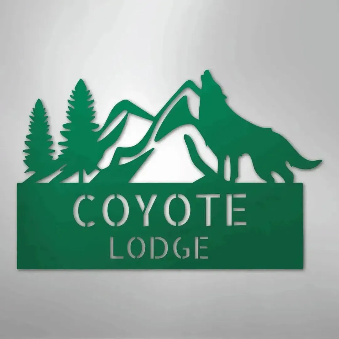 Green metal wall art featuring mountains, pine trees, a howling wolf, and "COYOTE LODGE" text.