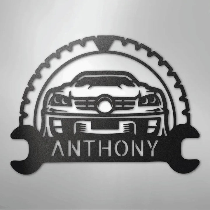 Black metal classic car monogram with "ANTHONY" text, gear, and wrench design.