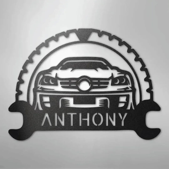 Black metal classic car monogram with "ANTHONY" text, gear, and wrench design.