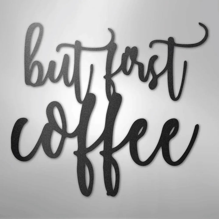 Black metal wall art decor with "but first coffee" in elegant script.