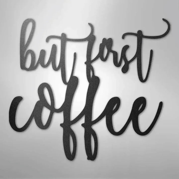 Black metal wall art decor with "but first coffee" in elegant script.