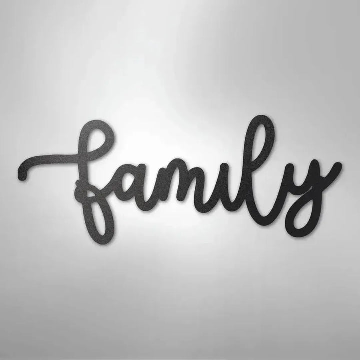 Black metal "family" script wall art in a flowing cursive font.