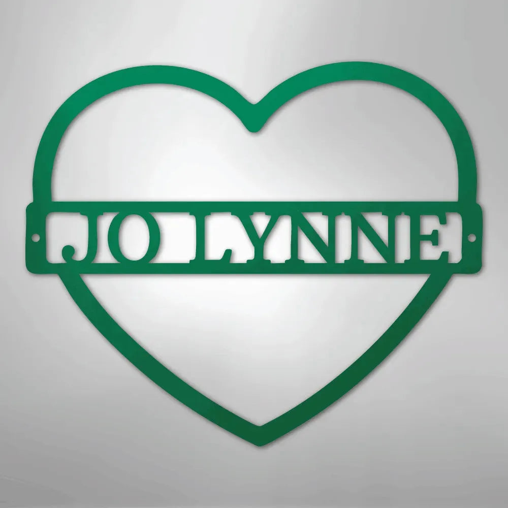 Green heart-shaped metal wall art with "JOLYNNE" cut out in the center.