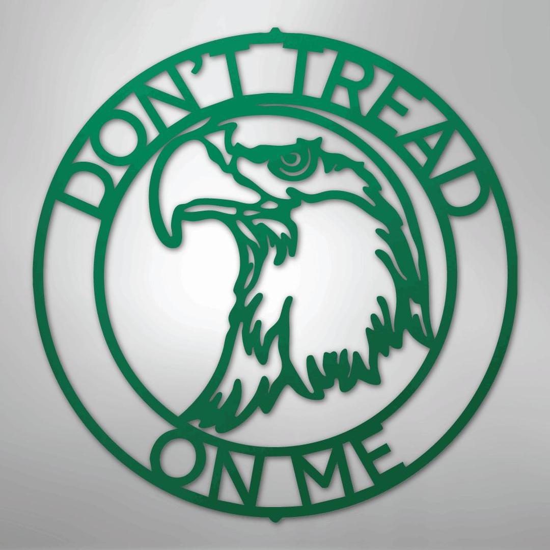 Green metal wall art: "Don't Tread On Me" text encircles an eagle head design.