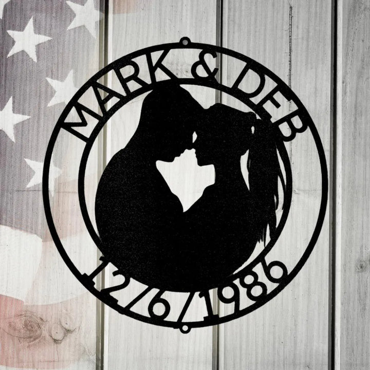 Black metal couple silhouette wall art with names Mark & Deb and date 12/6/1986.