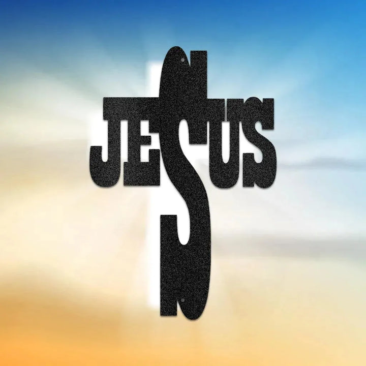 Black metal wall art forming a cross with "JESUS" integrated into its design, on a gradient background.