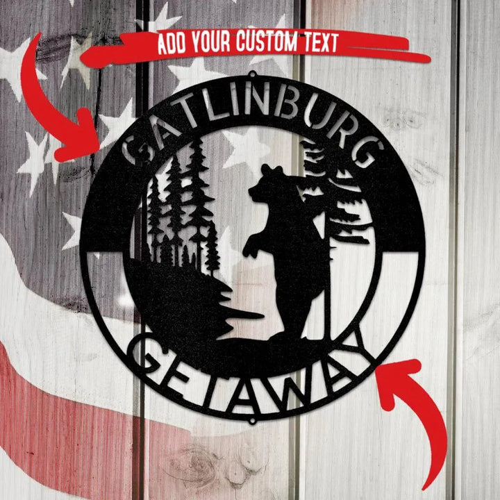 Black metal wall art with a bear, trees, and "Gatlinburg Getaway" text.