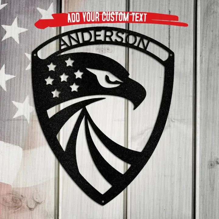 Black metal eagle monogram wall art with stars and "ANDERSON" text on a wood and flag background.