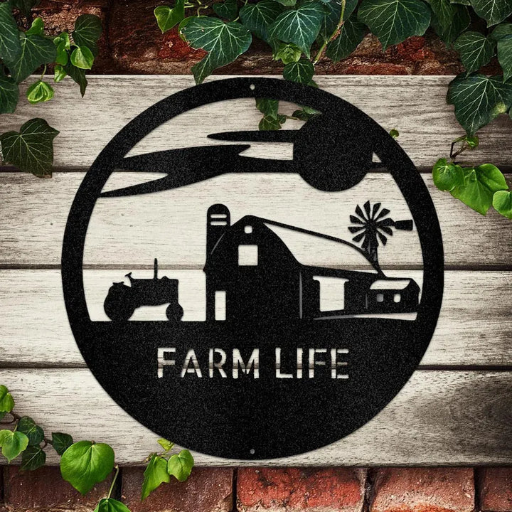 Black metal "Farm Life" monogram with barn, tractor, and windmill silhouette on a rustic wood and brick wall.