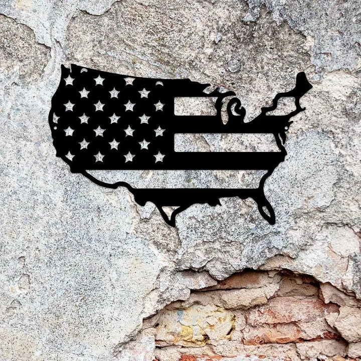 Black metal USA map wall art with stars and stripes design on a distressed concrete wall.