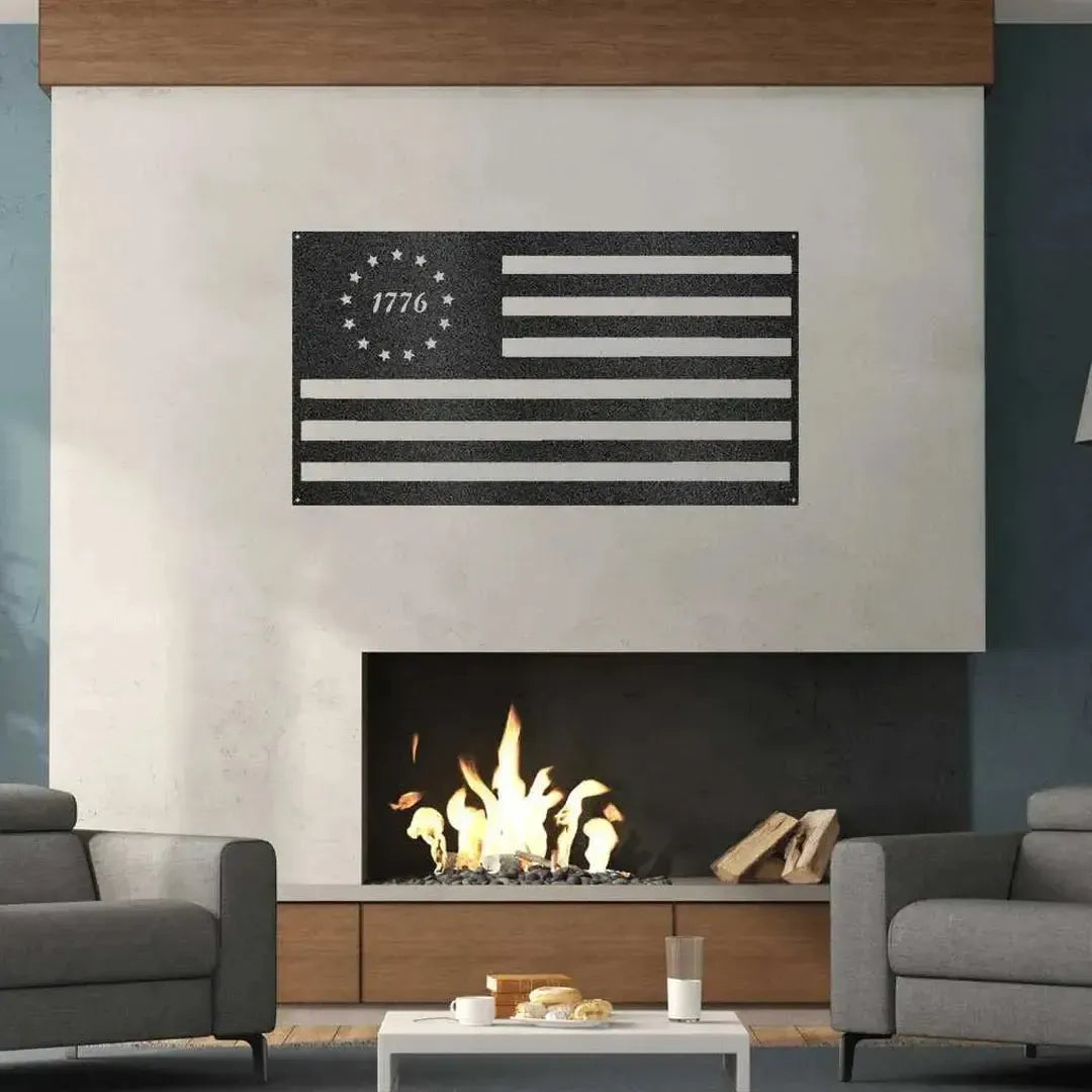 Black metal 1776 Flag wall art with stars and stripes, mounted above a modern fireplace.