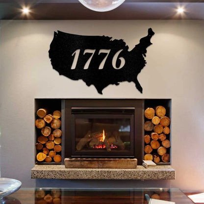 Black metal USA map wall art with "1776" cut out, displayed above a modern fireplace.