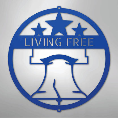 Blue metal Liberty Bell monogram wall art with "LIVING FREE" text and three stars.
