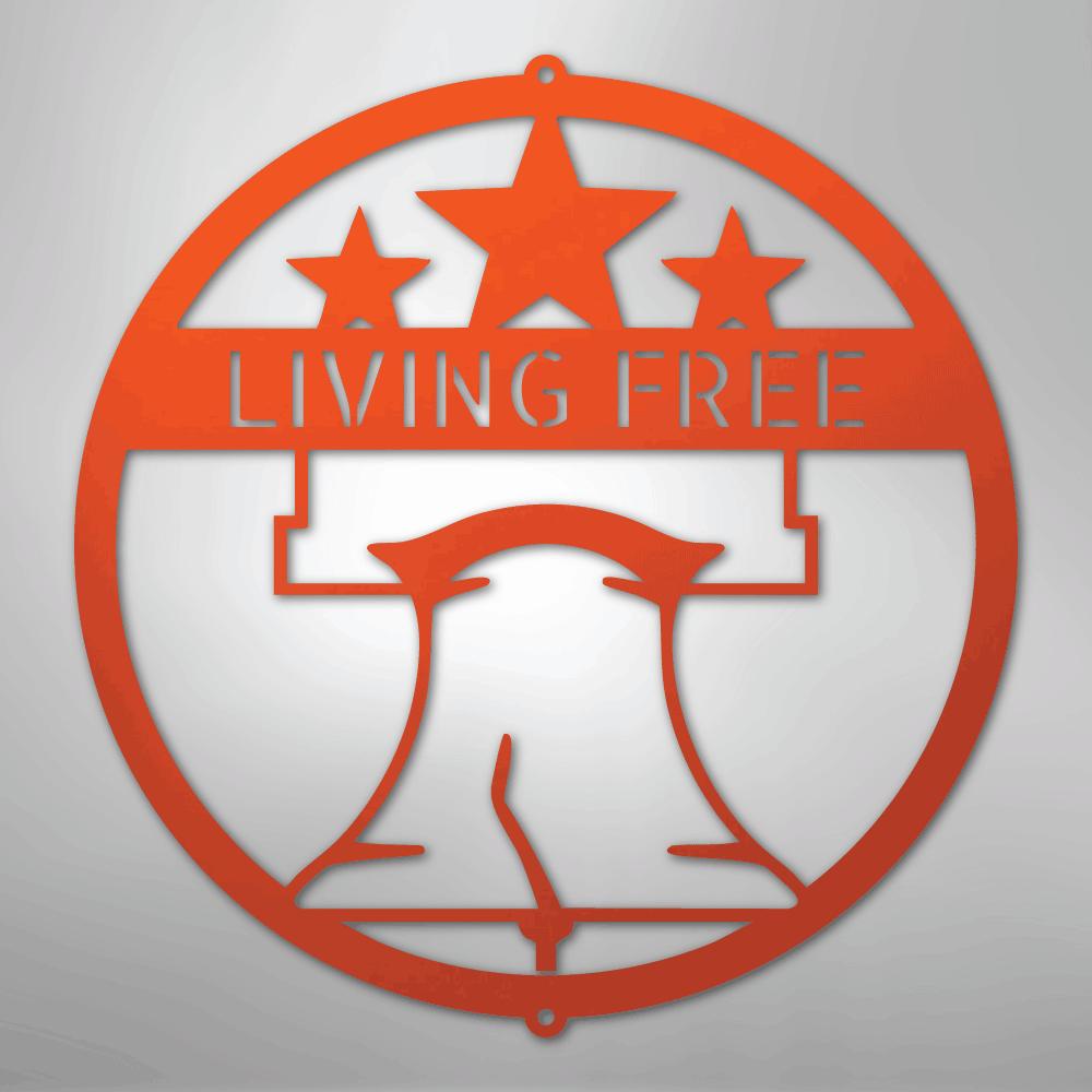 Orange metal wall art featuring a circular design with a Liberty Bell, three stars, and "LIVING FREE.