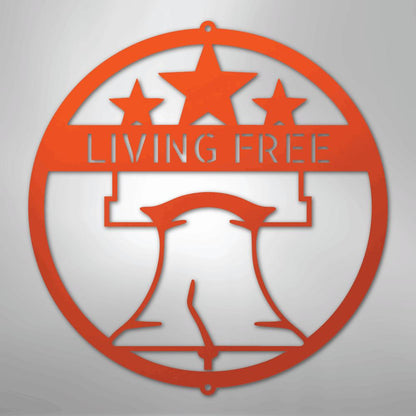 Orange metal wall art featuring a circular design with a Liberty Bell, three stars, and "LIVING FREE.