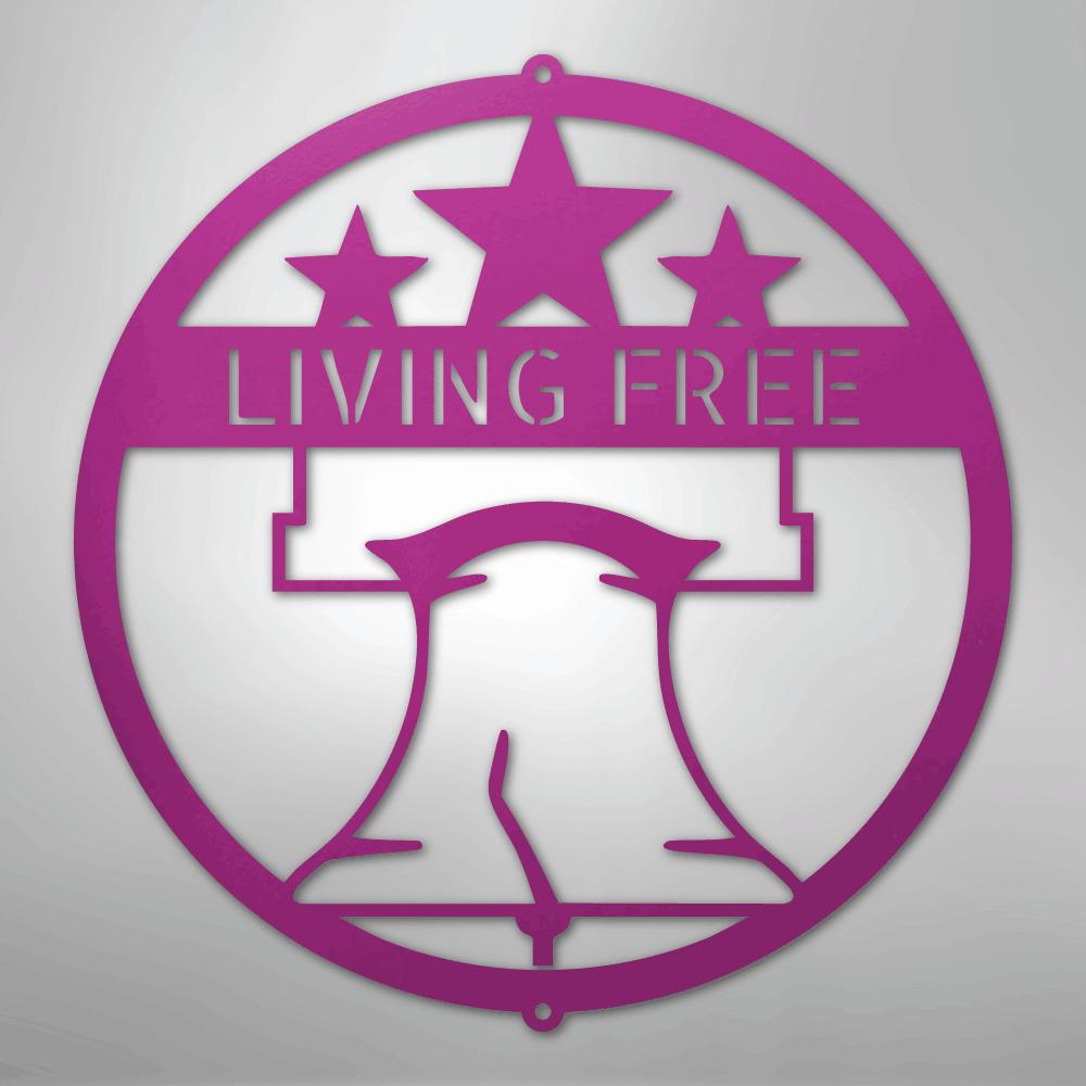 Pink metal Liberty Bell monogram wall art with "LIVING FREE" text and three stars.