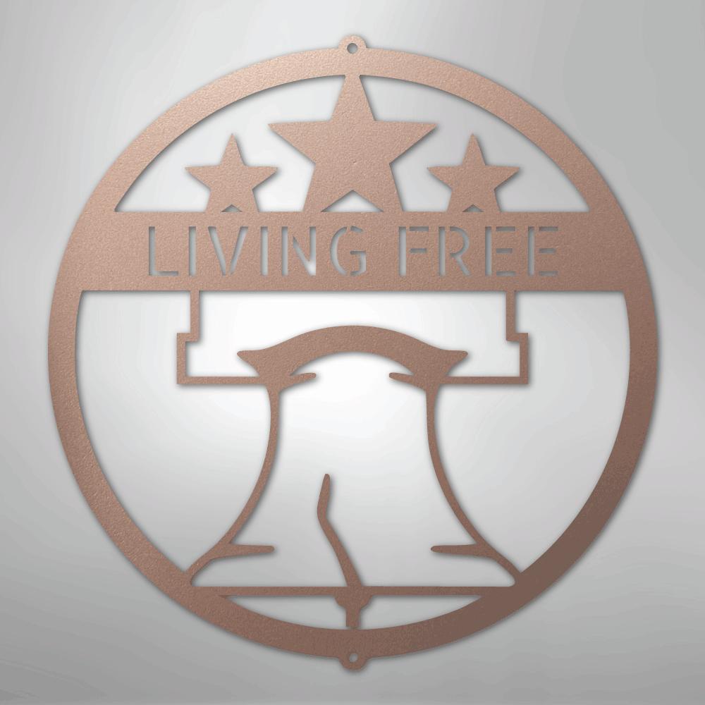 Copper metal wall art with a Liberty Bell, three stars, and "LIVING FREE" text in a circular design.