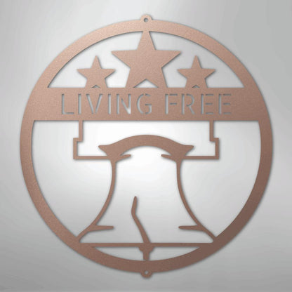 Copper metal wall art with a Liberty Bell, three stars, and "LIVING FREE" text in a circular design.