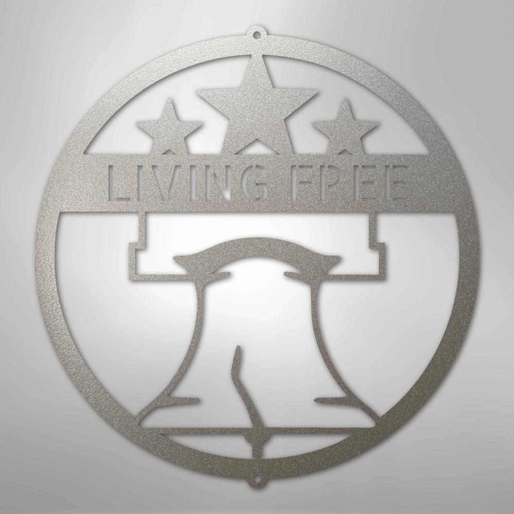 Silver metal Liberty Bell monogram wall art with "LIVING FREE" text and three stars.