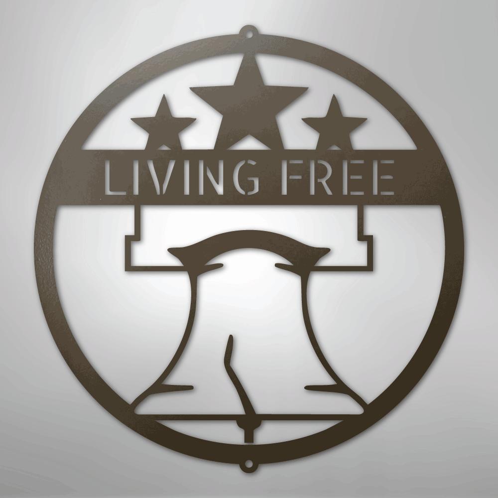 Brown metal Liberty Bell monogram wall art with "LIVING FREE" text and three stars.
