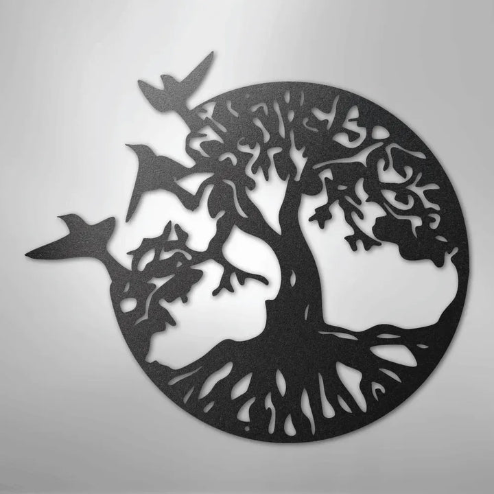 Black metal wall art depicting a tree of life with roots and branches, encircled, with three birds flying.