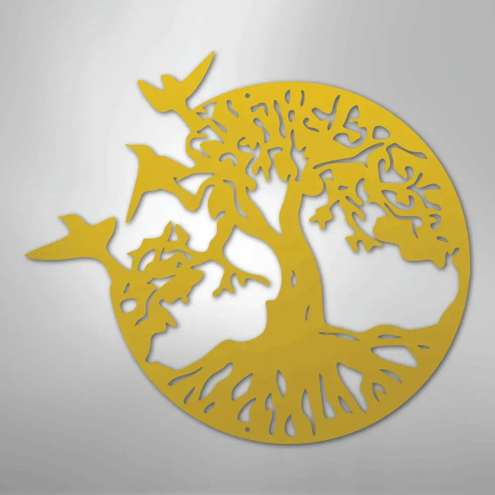 Yellow metal wall art featuring a tree of life design with three birds flying from its branches.