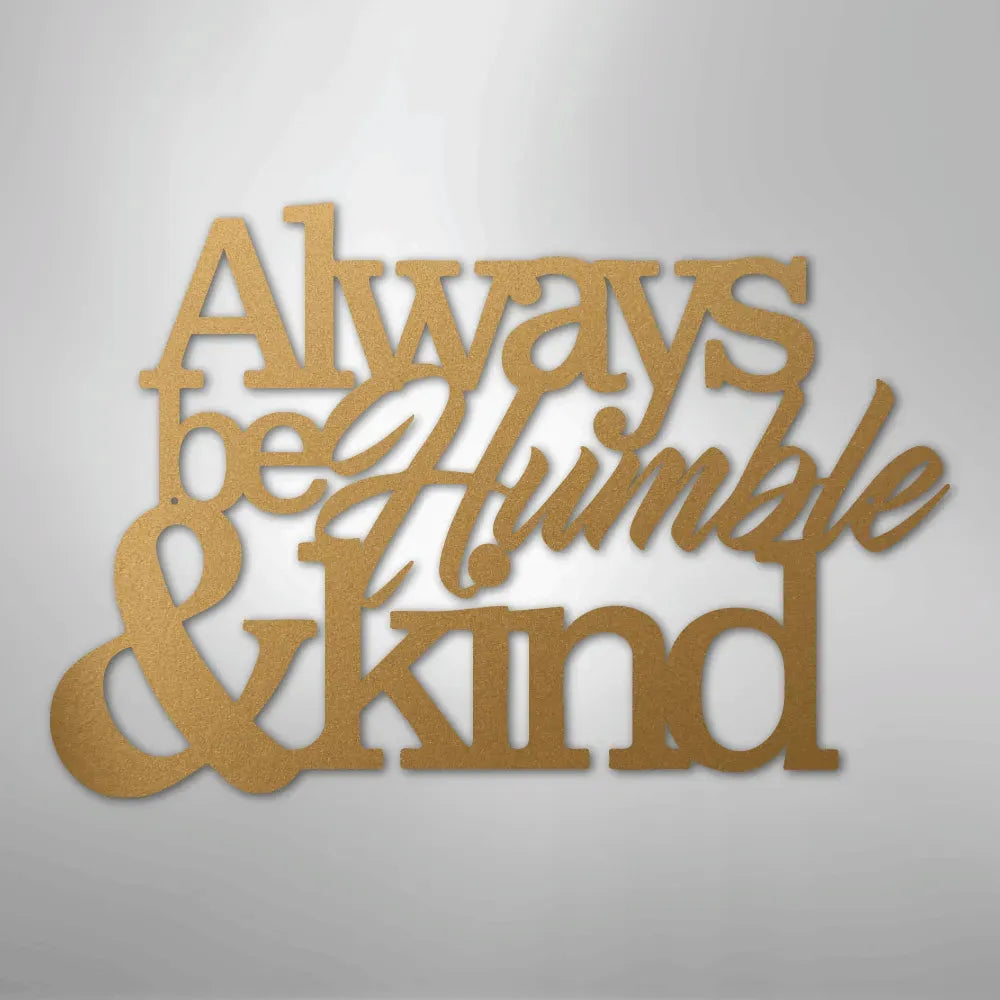 Gold metal wall art with "Always be Humble & Kind" in decorative script and block fonts.