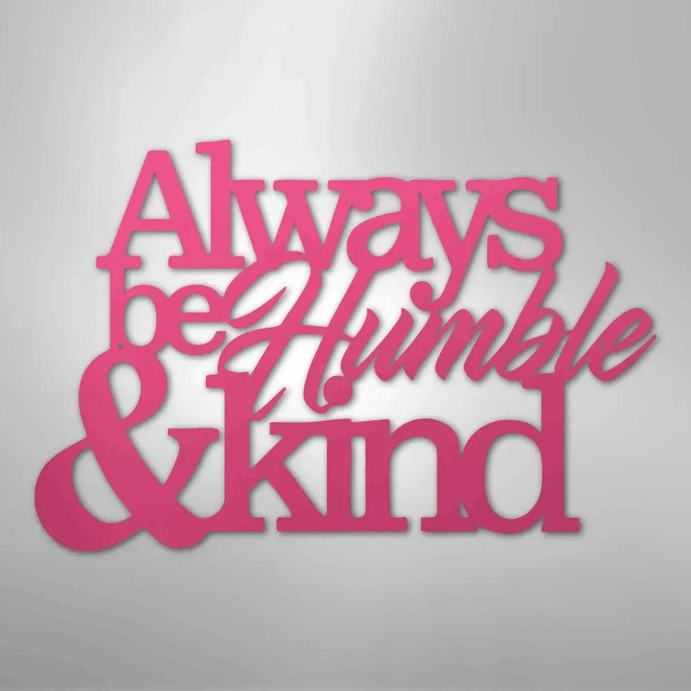 Pink metal wall art with "Always be Humble & Kind" in script and block fonts.