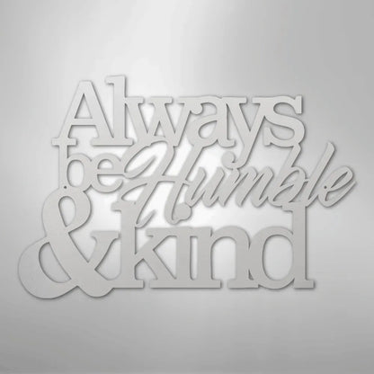 White metal wall art with "Always be Humble & Kind" in varied fonts.