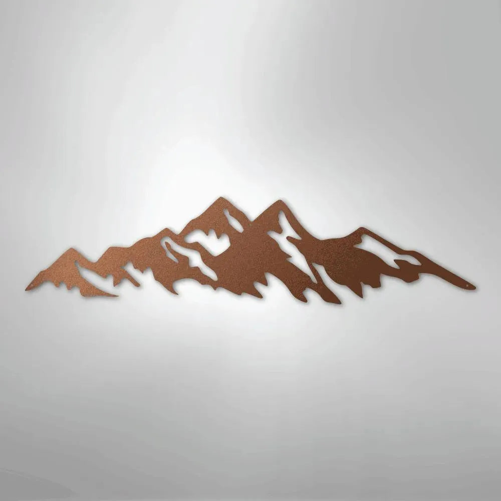 Copper-colored metal wall art depicting a mountain range silhouette with jagged peaks.