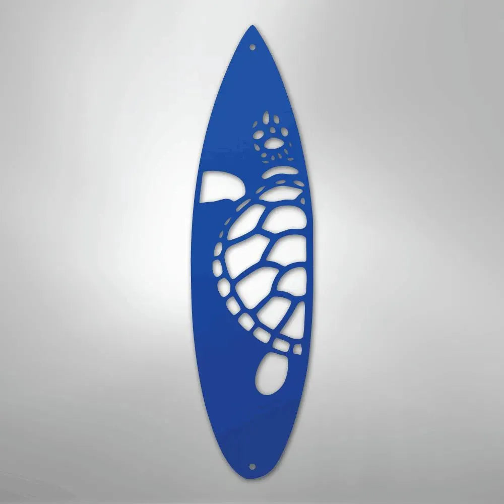 Blue metal wall art shaped like a surfboard with a cutout turtle design.