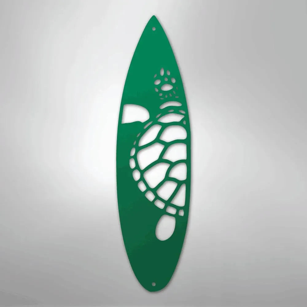 Green metal surfboard wall art with a cutout turtle design.