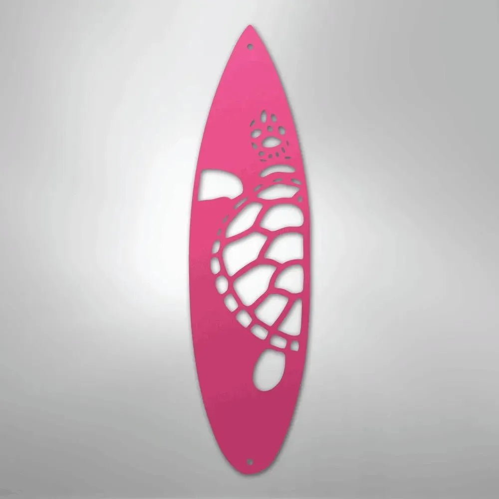 Pink metal surfboard wall art with a cutout turtle and paw prints.