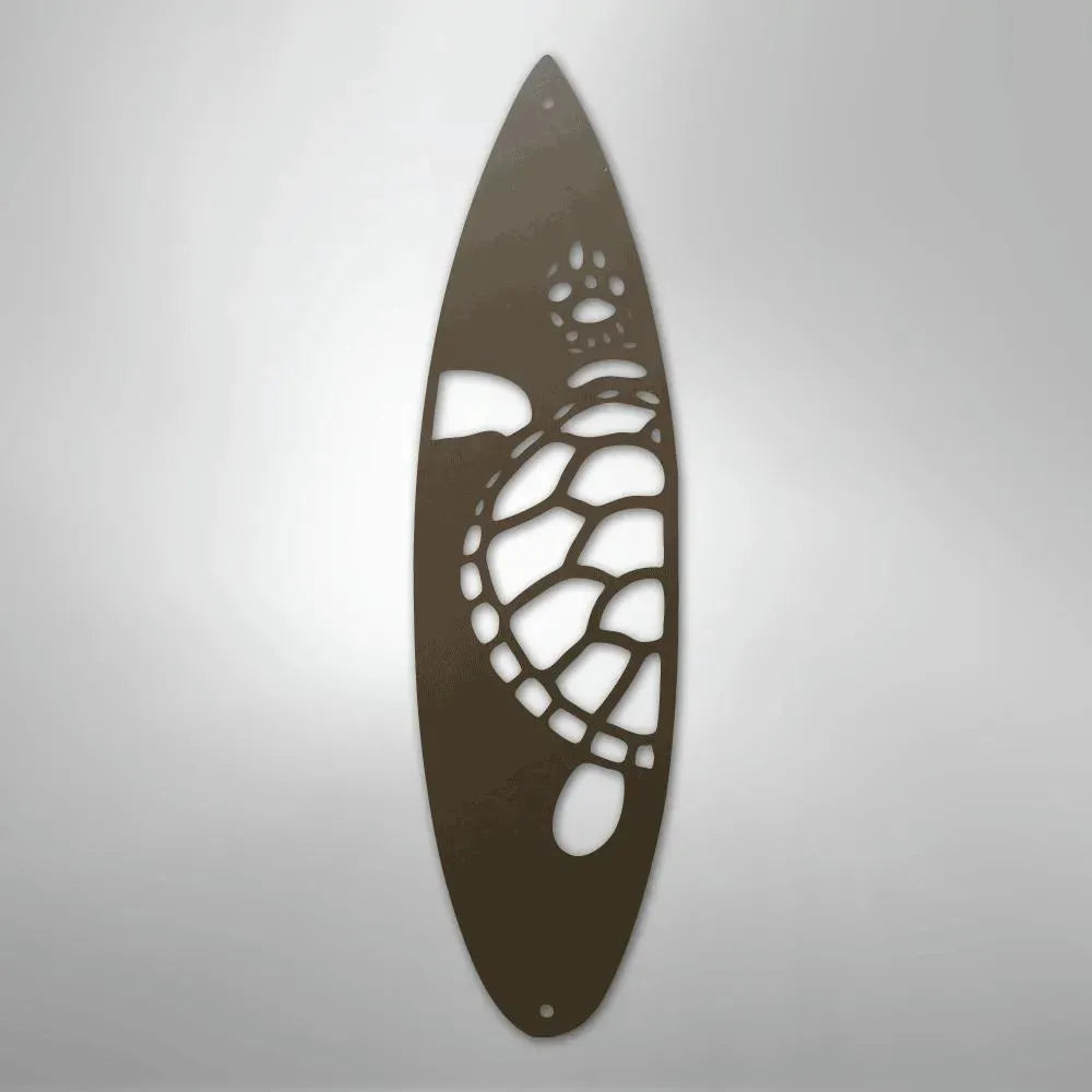 Brown metal wall art shaped like a surfboard with a cutout design of a sea turtle.