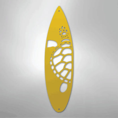 Yellow metal surfboard wall art with a cutout turtle design, ideal for indoor/outdoor decor.