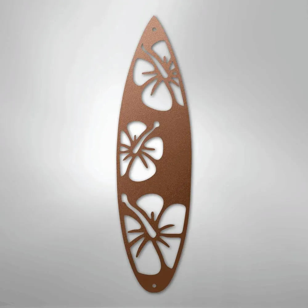 Copper metal surfboard wall art with three hibiscus cutouts.