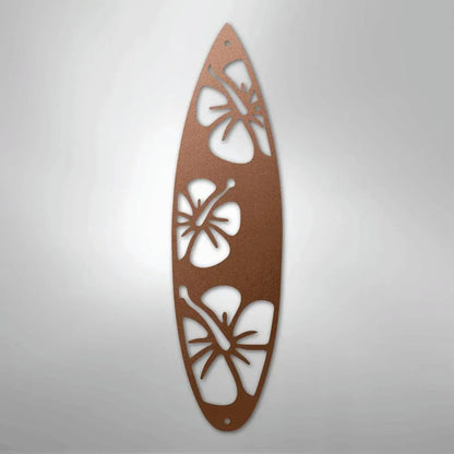 Copper metal surfboard wall art with three hibiscus cutouts.