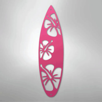 Pink metal surfboard wall art with hibiscus cutouts, ideal for indoor/outdoor decor.