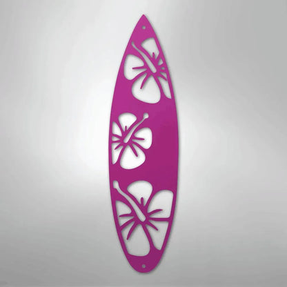 Pink metal surfboard wall art with hibiscus flower cutouts, powder-coated for indoor/outdoor decor.