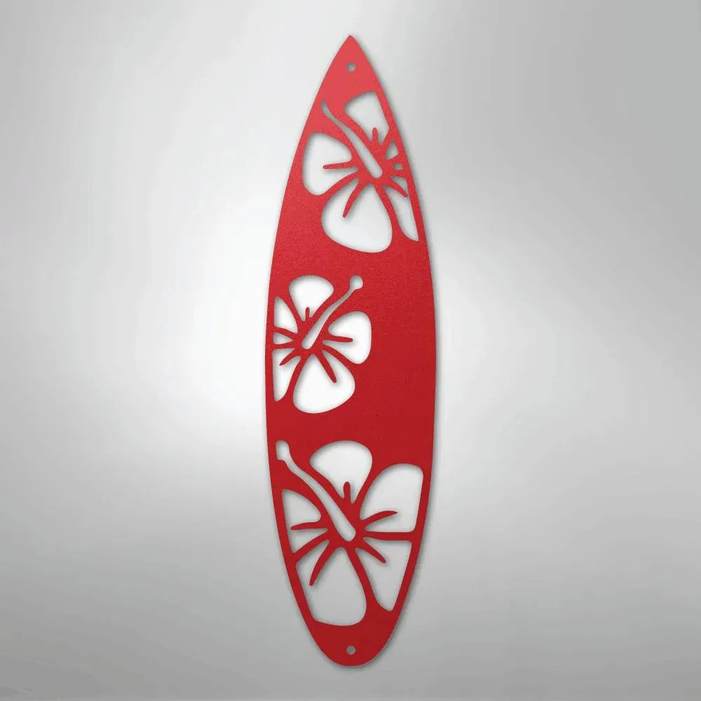 Red metal surfboard wall art with three hibiscus flower cutouts.