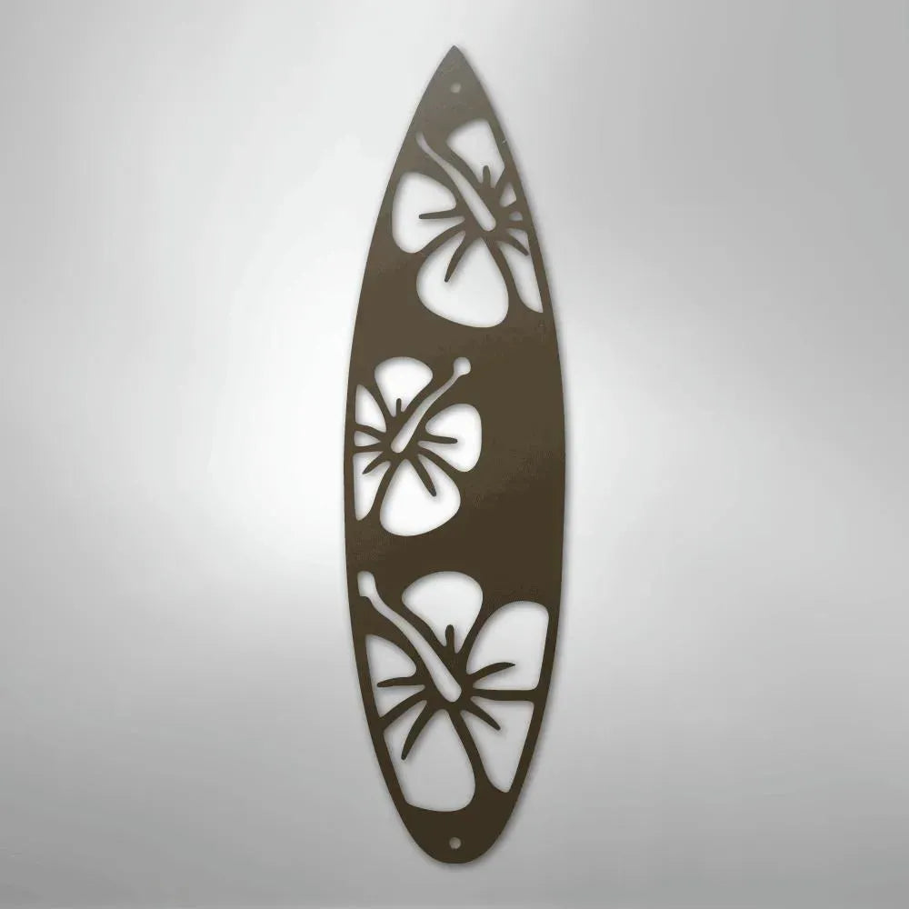 Brown metal surfboard wall art with three cutout hibiscus flower designs.