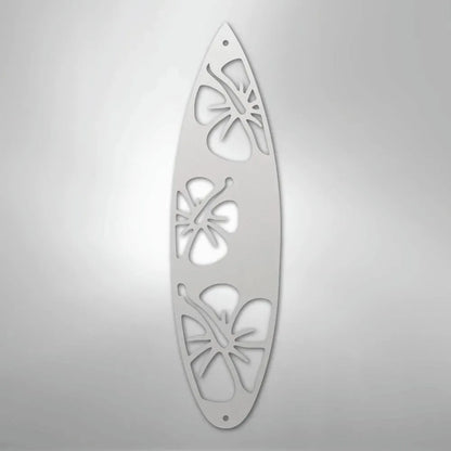 White metal surfboard wall art with three cutout hibiscus flower designs.